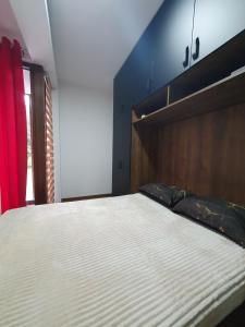 Tempat tidur dalam kamar di Apartmani Gavric Borovi 2