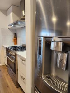 a kitchen with a stove and a stainless steel oven at Bullseye in Yarrawonga