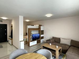 a living room with a couch and a table at Katerina Apartments 9 in Velingrad