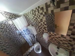 a bathroom with a toilet and a sink at Rafting Campsite Stari Dud in Foča +54 photos