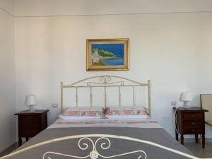 a bedroom with a bed and two nightstands at GiuMar in Vieste +66 photos