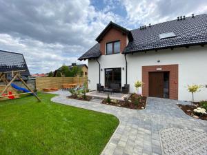 Сад в Wczasy Chmielno Apartament Turkusowy
