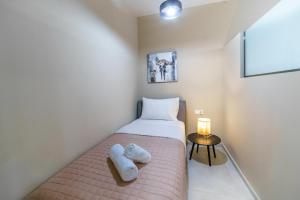 Postel nebo postele na pokoji v ubytování Palm home 1