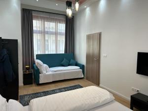 Postel nebo postele na pokoji v ubytování Lizu Apartmant