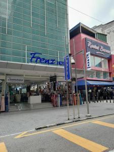 a shopping center with a large glass building at Frenz Hotel Kuala Lumpur in Kuala Lumpur