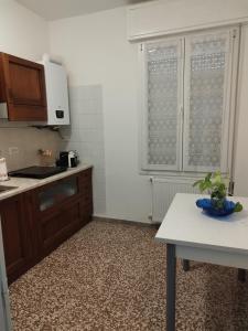 a kitchen with a sink and a counter top at Da Silvana in Rovereto +2 photos