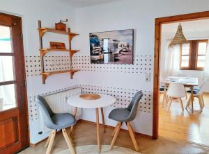 a dining room with a table and two chairs at Ferienwohnung Sankt Martin 225 N.N. in Sankt Martin