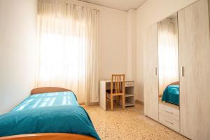 Posteľ alebo postele v izbe v ubytovaní Appartamento Centrale Panoramico