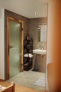 a bathroom with a sink and a mirror at SONNE Wilhams in Missen-Wilhams