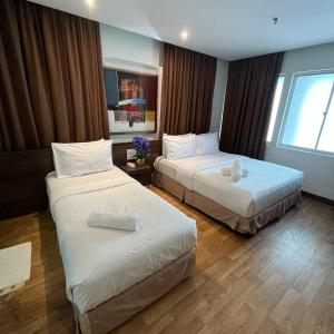 Postel nebo postele na pokoji v ubytování Frenz Hotel Kuala Lumpur