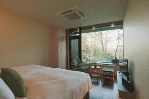 Postel nebo postele na pokoji v ubytování KANAYA RESORT HAKONE
