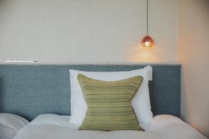 Postel nebo postele na pokoji v ubytování KANAYA RESORT HAKONE