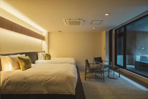 Postel nebo postele na pokoji v ubytování KANAYA RESORT HAKONE