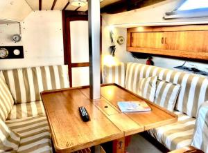 a coffee table with a remote control on a table at Casa Veleiro SHALOM in Ponta Delgada