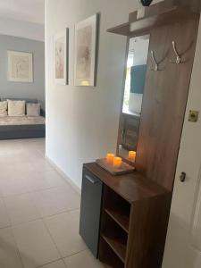 a room with a counter with candles on it at Studio in the center, 2 mins from the beach in Loutraki