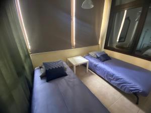A bed or beds in a room at Playamar Primera linea front beach