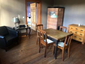 a dining room with a table and chairs and a couch at Landbahnhof Buschhof 1 Stock in Buschhof
