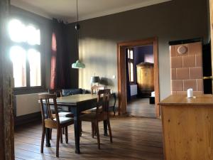 a dining room with a table and chairs at Landbahnhof Buschhof 1 Stock in Buschhof