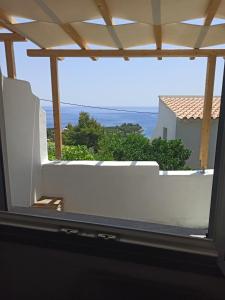 a view from the window of a house at AQUAMARINE APARTMENT in Patitiri