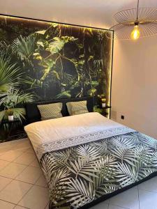 En eller flere senger på et rom på Le Tropical sublime ambiance Jungle proche Metz