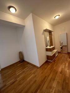 an empty room with a sink and a mirror at APARTMAN RAFAILOVICI in Budva