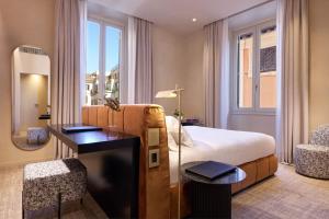 Postel nebo postele na pokoji v ubytování Borghese Contemporary Hotel