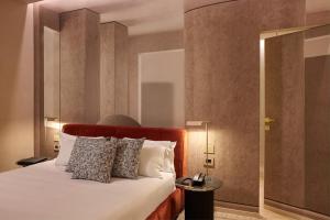 Postel nebo postele na pokoji v ubytování Borghese Contemporary Hotel