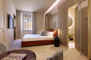 Postel nebo postele na pokoji v ubytování Borghese Contemporary Hotel