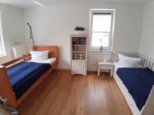 Postel nebo postele na pokoji v ubytování Ferienwohnung Schwalbennest