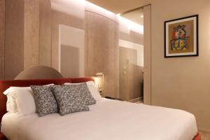 Postel nebo postele na pokoji v ubytování Borghese Contemporary Hotel