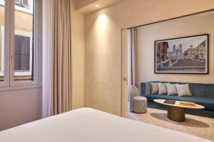 Postel nebo postele na pokoji v ubytování Borghese Contemporary Hotel