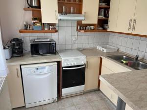 Kuchyň nebo kuchyňský kout v ubytování Erdőgyöngye Vendégház CSÖDE + 8 fotografií