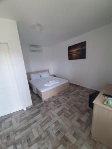 Postel nebo postele na pokoji v ubytování SunRise