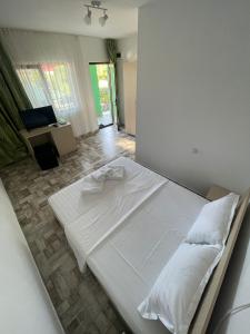 Postel nebo postele na pokoji v ubytování SunRise