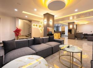a living room with a couch and a table at Selia SUİTES in Trabzon