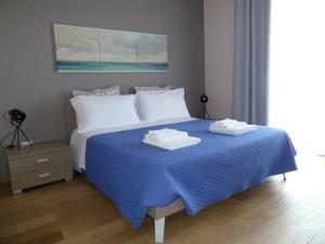 Кровать или кровати в номере Sole e mare