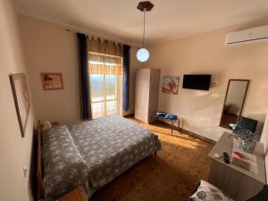 TV a/nebo společenská místnost v ubytování B&B EMPIRA Lamezia Terme