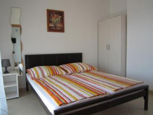 Postel nebo postele na pokoji v ubytování Apartments Roko
