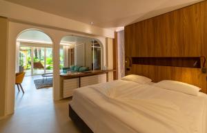 Un pat sau paturi într-o cameră la Albergo Losone