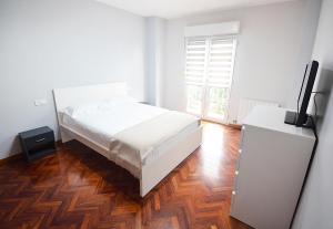 Posteľ alebo postele v izbe v ubytovaní Apartamento en Fefiñanes, Cambados