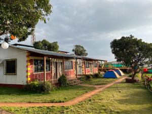 a building with tents in front of it at Heavens Edge Resort in Mahabaleshwar