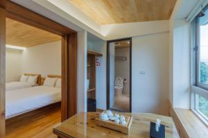 Postel nebo postele na pokoji v ubytování Hou Shan Ren Jia B&B Hall A