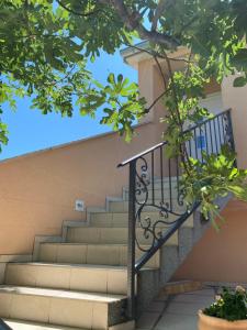 a set of stairs leading up to a house at Guest House Lorenta in Vodice