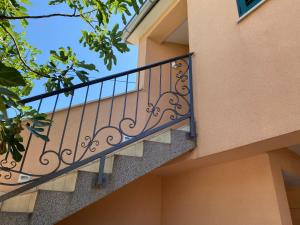a balcony on the side of a building at Guest House Lorenta in Vodice