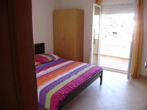 Postel nebo postele na pokoji v ubytování Apartments Roko