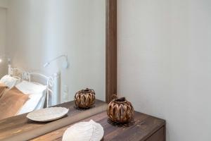 A bed or beds in a room at Harmony Apartments