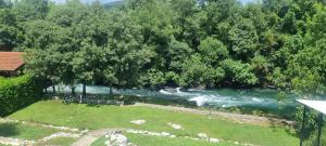 an aerial view of a river with trees at Villa Longina in Ljubuški