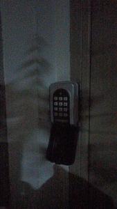 a cell phone is hanging on a wall at Villa Eden 111, Perla Resort, Bay of Lalzi in Durrës