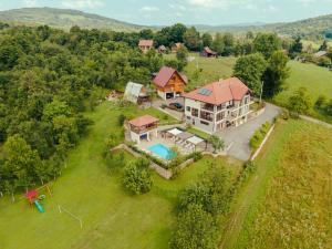 an aerial view of a large house with a pool at Jankovi Dvori in Rakovica