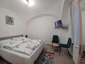 Posteľ alebo postele v izbe v ubytovaní RÁD-VÁR Apartmanház